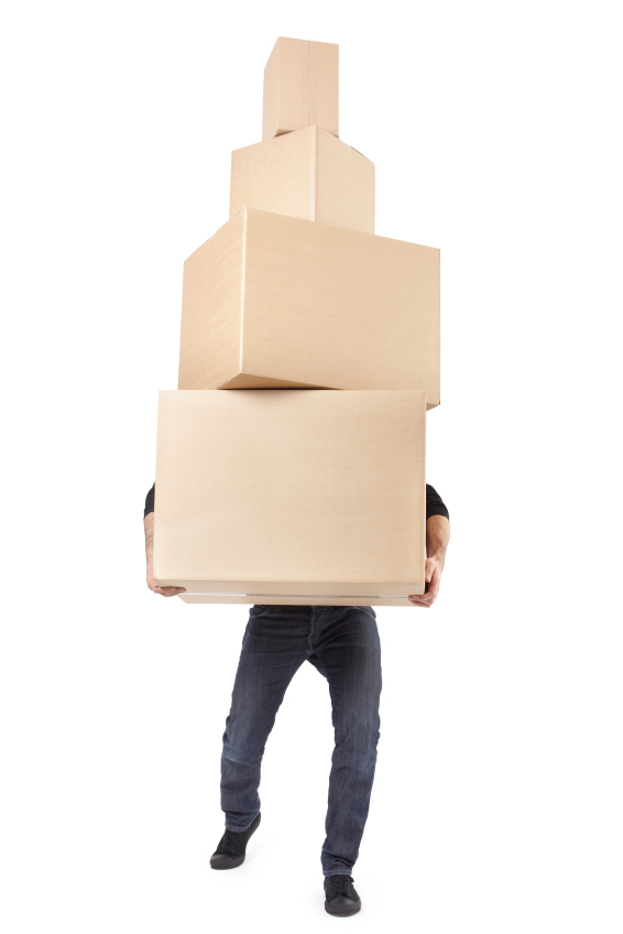 Man lifting cardboard boxes on white with clipping path